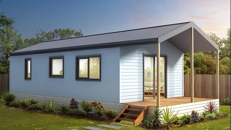 Clad granny flat with pitched roof and covered timber verandah