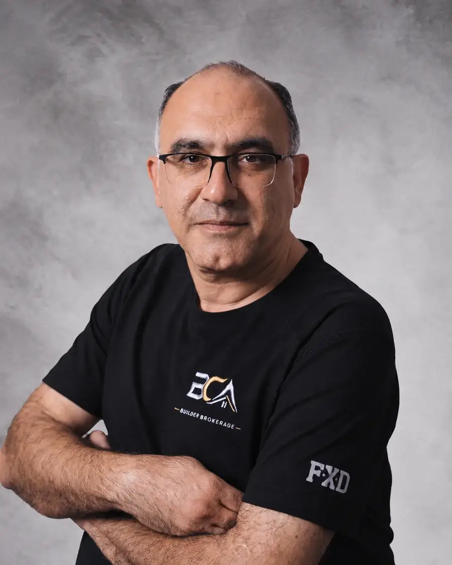 BCA team member wearing glasses and a black BCA shirt